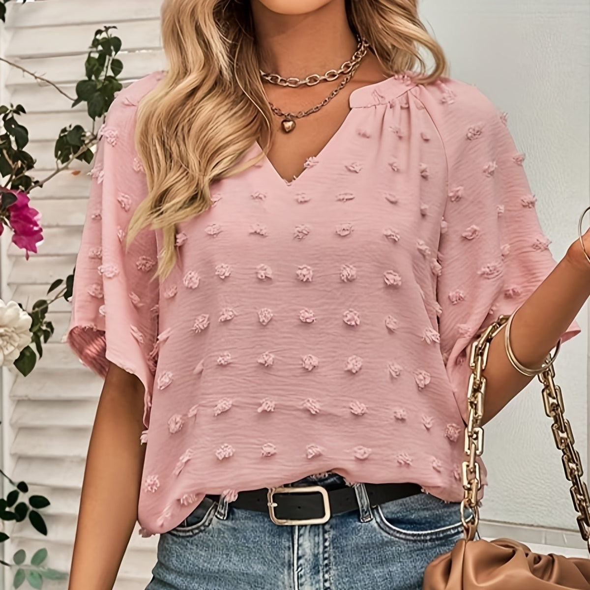 Blusa de gola V com bolinhas